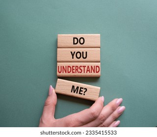 Do you understand me symbol. Concept words Do you understand me on wooden blocks. Beautiful grey green background. Businessman hand. Business and Do you understand me concept. Copy space. Conceptual  - Shutterstock ID 2335415533