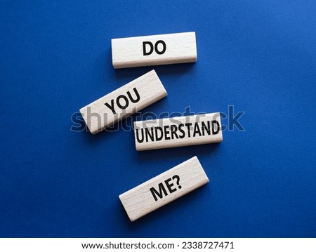 Do you understand me symbol. Concept words Do you understand me on wooden blocks. Beautiful deep blue background. Business and Do you understand me concept. Copy space.
