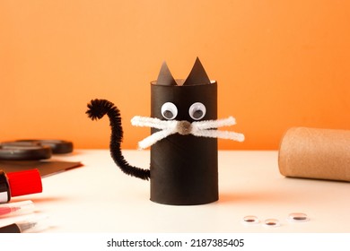 Do It Yourself Creative Craft For Kids. Halloween Family Activity. Handmade Decoration From Toilet Paper Roll Cute Funny Black Cat. Reuse Concept