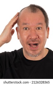 Do It Yourself Pandemic Haircut For Man: A Man Looking Surprised After Shaving Off Half Of His Head