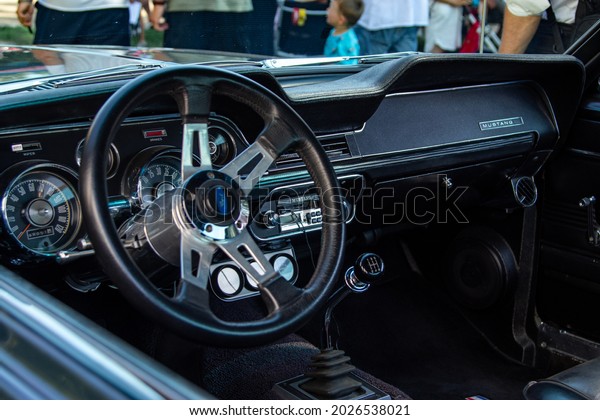 Dobrichovice, Czech Republic - August 14th 2021:\
Black interior of a Ford Mustang Bullit at car show Veterani pod\
zamkem 2021.