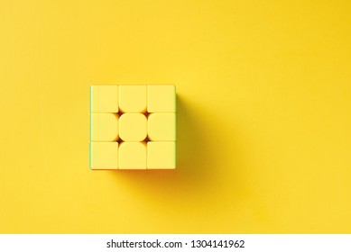 Dobrush, Belarus - 3 February 2019. Rubics Cube On Yellow Background, Top View