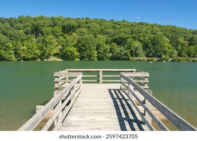 A dock extends onto the waters of Squantz Pond.