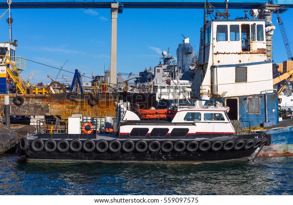 Dock Full of Junk and Rusty Equipment\
in a Navy Ship Yard - Coronado Island,\
California.