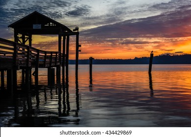 Dock looking out over the water at sunrise in Olympia, Washington