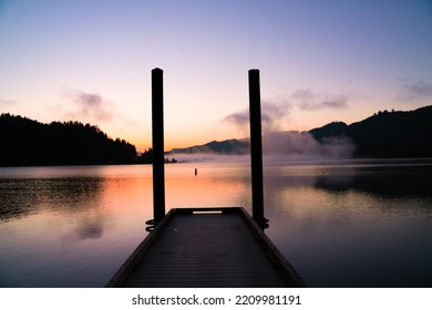 Dock With Misty Lake Before Sunrise