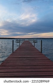 Dock On Mullett Lake In Indian River Michigan With Pastel Skies Overhead