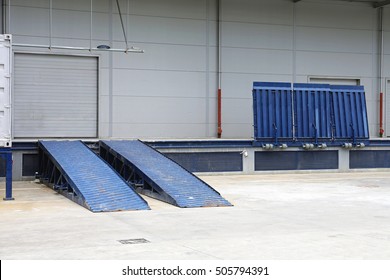Dock Ramp And Door At Distribution Warehouse