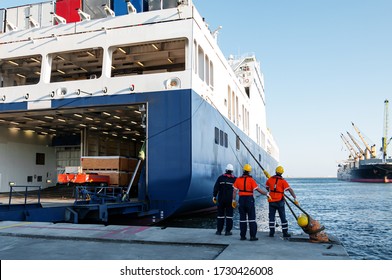 Dock workers pulling ship rope - Powered by Shutterstock