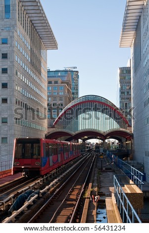 A Docklands Light Rail train passing through Canary Wharf in London