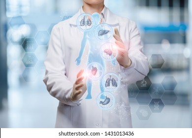 The doctor adjusts the health of the person on the blurred background.