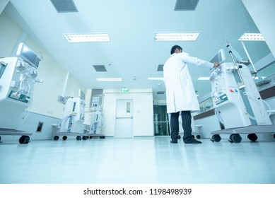 Doctor And Advanced Dialysis Equipment In Hospital Background For Commercial Business