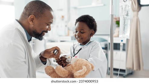 Doctor, African kid and stethoscope for teddy bear, smile or play for recovery from surgery, game or breathing. Child patient, medic and boy with toys, talk or consulting for rehabilitation in clinic - Powered by Shutterstock