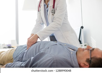 Doctor Analyzing Abdomen Patient Examination Room Stock Photo 