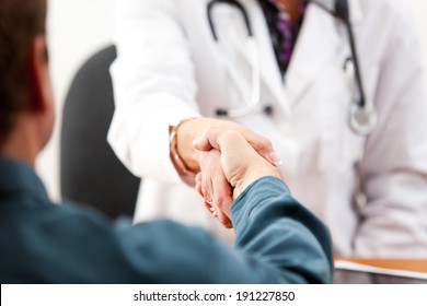 Doctor: Anonymous Patient And Female Doctor Shaking Hands