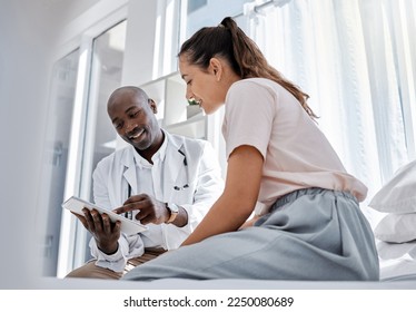 Doctor appointment or healthcare professional consulting a patient and showing her online medical results on a tablet. Medical worker or GP talking to a woman in a hospital or clinic - Powered by Shutterstock