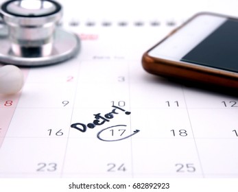 Doctor Appointment Reminder On Calendar With Mobile Phone; Medical Concept.