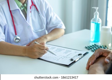 The doctor asking about medical history to check the results of the annual physical examination. And follow the symptom check after taking the medicine, health examination concept And give advice - Shutterstock ID 1861213417
