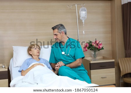 Similar – Female doctor filling questionnaire to senior patient