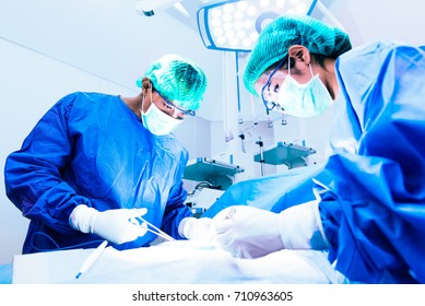 Doctor and assistant nurse operating for help patient from dangerous emergency case, Hospital and Surgery Concept, Health care and Medical concept, Cancer and disease treatment