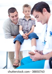 Doctor Bandaging A Child's Foot In Hospital