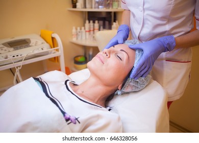 doctor beautician increases lip patient an injection syringe Spa
