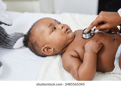 Doctor, black baby and stethoscope to listen in clinic, sick patient and monitor pulse for healthcare. Pediatrician, child and tool to check for heartbeat or exam on lungs, girl and infant for test - Powered by Shutterstock