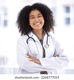 Doctor, black woman and smile portrait for healthcare with life insurance in hospital for wellness. Face of happy medical professional with arms crossed with pride for career, motivation and medicine