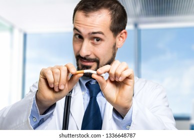 Doctor Breaking A Cigarette