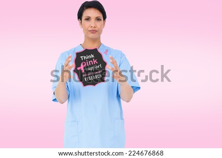 Doctor with breast cancer awareness message for awareness month
