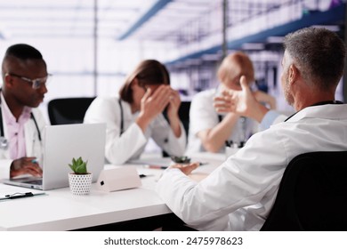 Doctor Bullying Hospital Team At Training Meeting - Powered by Shutterstock