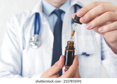 Doctor with cannabis hemp and oil. Medical clinic with modern neurological treatment