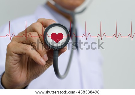 Doctor (cardiologist) with stethoscope in hand and EKG (electrocardiogram) graph monitor, health and medical concept.