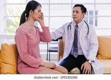 Doctor Care Support To Help And Comforting Patients From Stress After Receiving Bad Medical News About Illness Symptom. Adult Woman Feel Bad Headache When Diagnosed With Cancer.