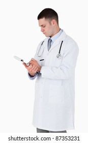 Doctor Carefully Taking Notes On White Background