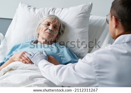 Similar – Female doctor comforting older female patient