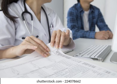 Doctor to check the medical records - Shutterstock ID 224078662