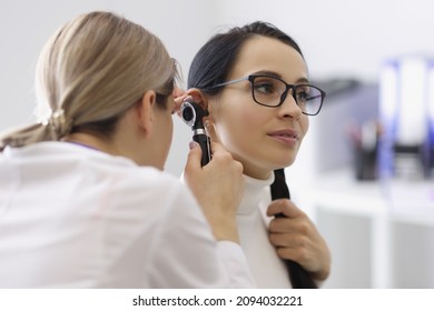 Doctor Check Patients Ear On Medical Examination With Special Tool
