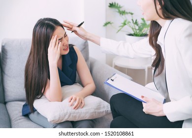 Doctor Check The Symptoms Of Young Women Stressed Patient With Headache, Doctor And Patient Discussing At Home, Doctor Comforting Young Women Stressed Patient With Headache