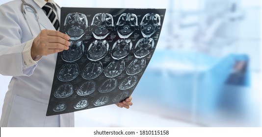 Doctor check up x-ray film of the brain by ct scan brain at patient room hospital. wide view.