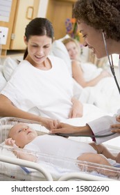 Doctor Checking Baby's Heartbeat With New Mother Watching