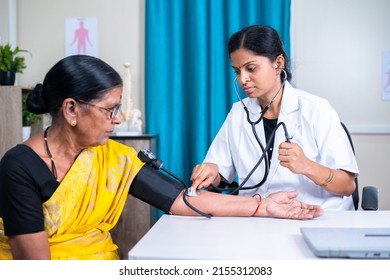 Doctor Checking Blood Pressure Or Bp Of Senior Woman Patient At Hospital - Concept Of Health Care, Medical Treatment And Consultation.