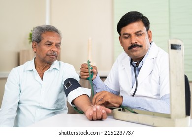 Doctor Checking Blood Pressure Of Elderly Patient At Hospital - Concept Of Routine Health Checkup, Treatment And Medicare