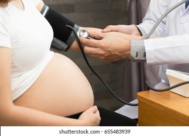 Doctor Is Checking The Blood Pressure Of Pregnant Women