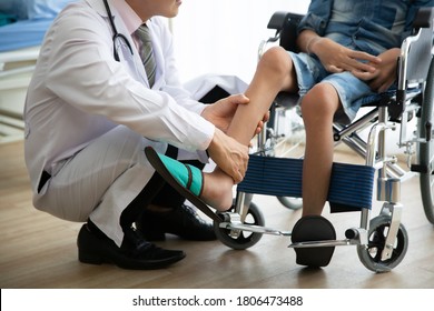 Doctor checking disabled person pateint leg at hospital, Muscle weakness