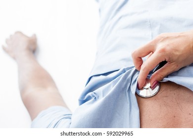 Doctor Checking On Patient Heart Rate.