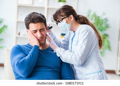 Doctor Checking Patients Ear During Medical Examination