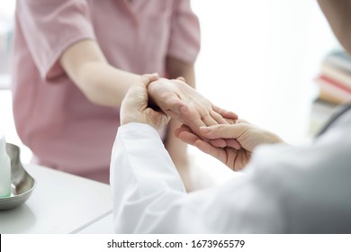 Doctor checking patient's hand pain - Powered by Shutterstock