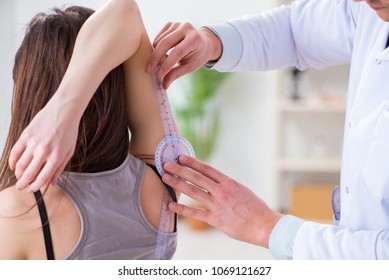 Doctor checking patients joint flexibility - Powered by Shutterstock