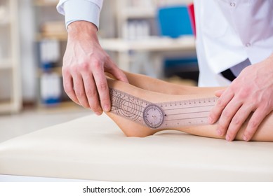 Doctor checking patients joint flexibility - Powered by Shutterstock